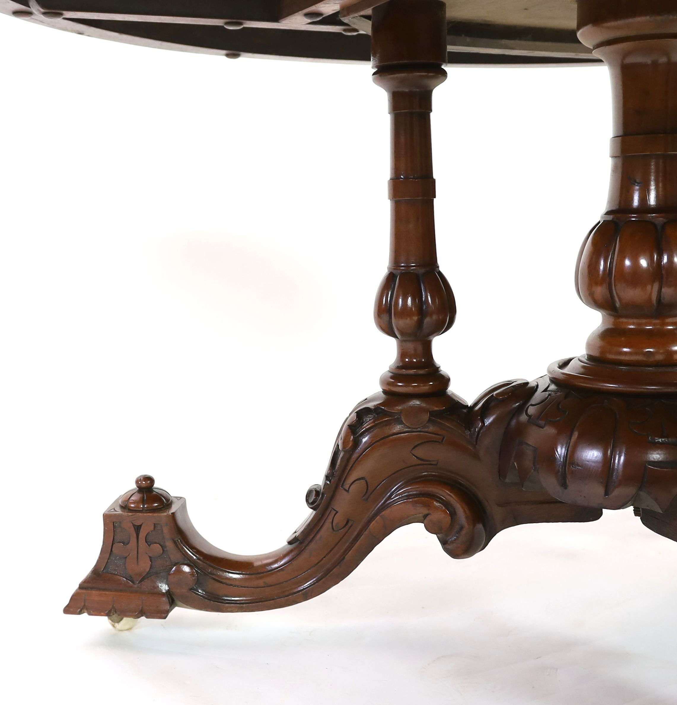 A Victorian walnut and marquetry breakfast table, diameter 144cm H.77cm